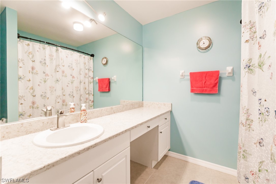 217 Manatee Street Fort Myers, FL 33913 - Photo 29 of 38 a bathroom with a sink a vanity and a mirror
