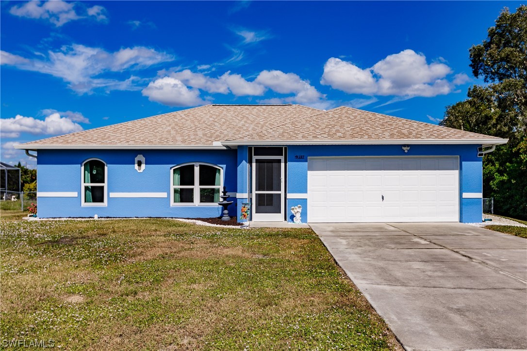 217 Manatee Street Fort Myers, FL 33913 - Photo 3 of 38 a house view with a garden space