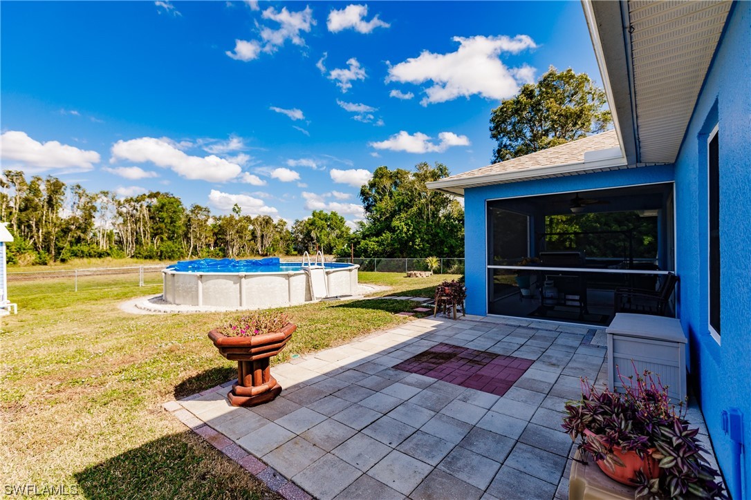 217 Manatee Street Fort Myers, FL 33913 - Photo 35 of 38 a swimming pool with outdoor seating and yard