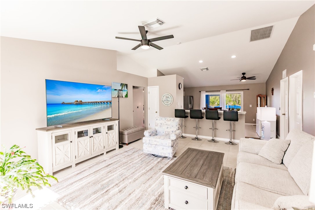 217 Manatee Street Fort Myers, FL 33913 - Photo 6 of 38 a living room with furniture and a flat screen tv