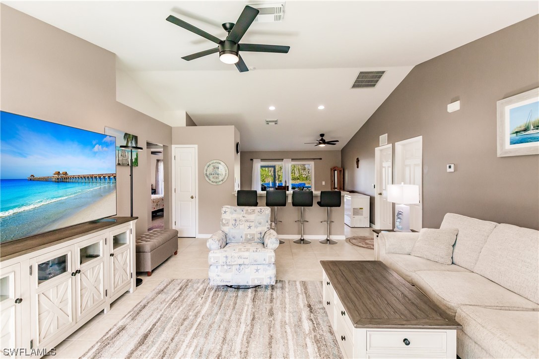 217 Manatee Street Fort Myers, FL 33913 - Photo 7 of 38 a living room with furniture and a kitchen view