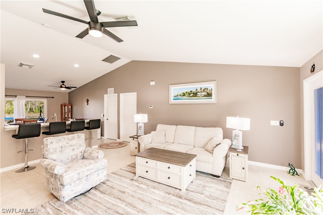 217 Manatee Street Fort Myers, FL 33913 - Photo 8 of 38 a living room with furniture and a ceiling fan