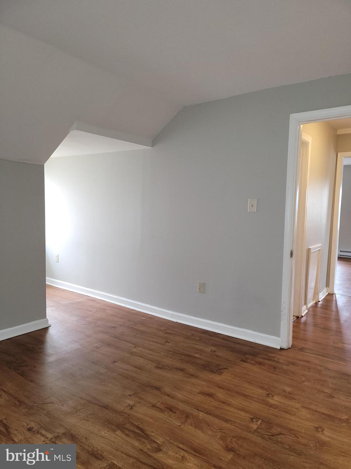 503 North Rodney Street, Unit 3A Wilmington, DE 19805 - Photo 14 of 18 a view of an empty room with wooden floor