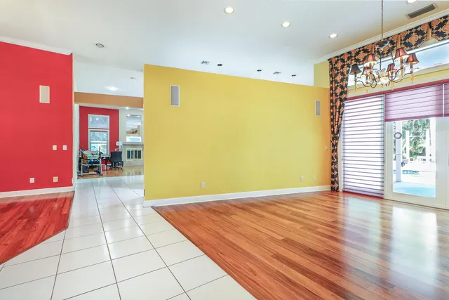 a view of a kitchen with fridge and outdoor shower