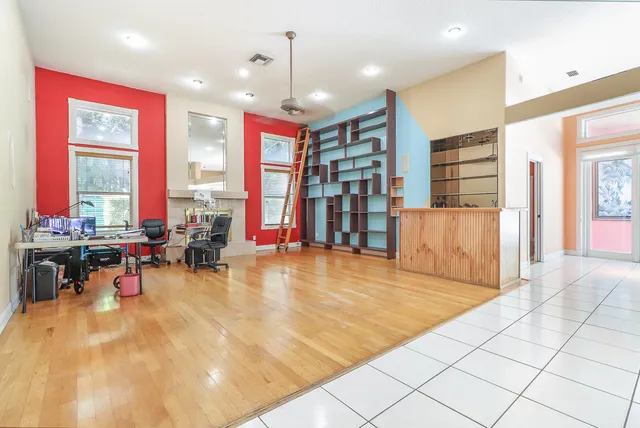 a kitchen with stainless steel appliances kitchen island granite countertop a sink and cabinets