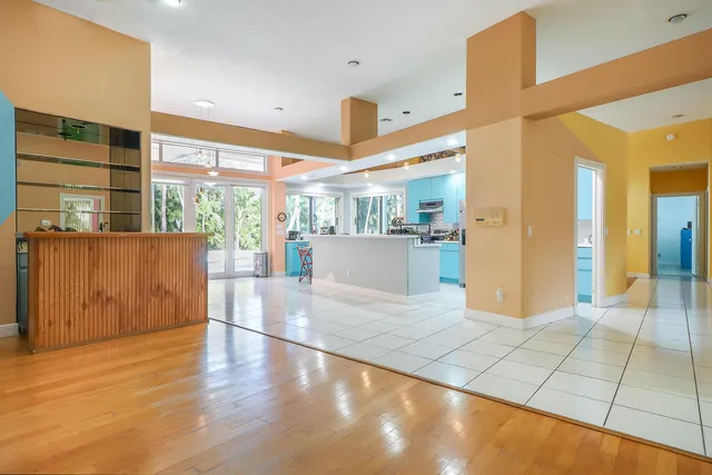 a kitchen with stainless steel appliances granite countertop a stove microwave and sink