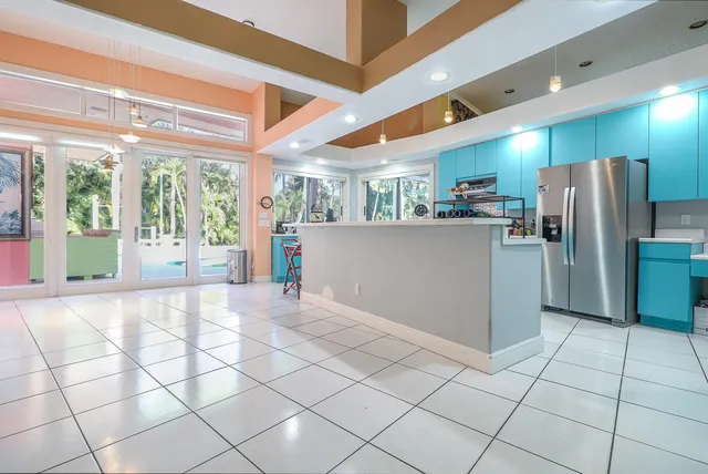 a kitchen with stainless steel appliances a sink window and a counter top space