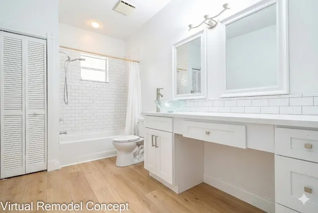 a bathroom with a bathtub and a sink