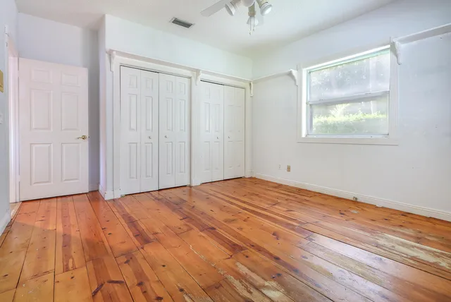 a swimming pool with outdoor seating and yard
