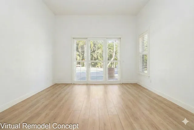 a view of a house with a yard and garden