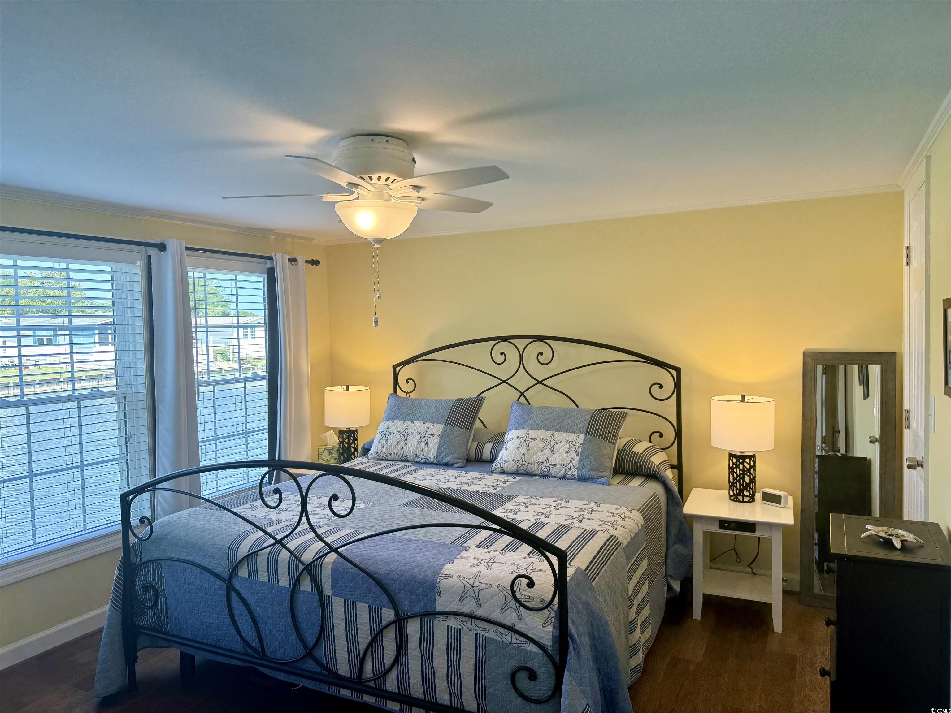 416 Oceanside Drive Surfside Beach, SC 29575 - Photo 10 of 37 Bedroom featuring wood finished floors, ornamental molding, and a ceiling fan