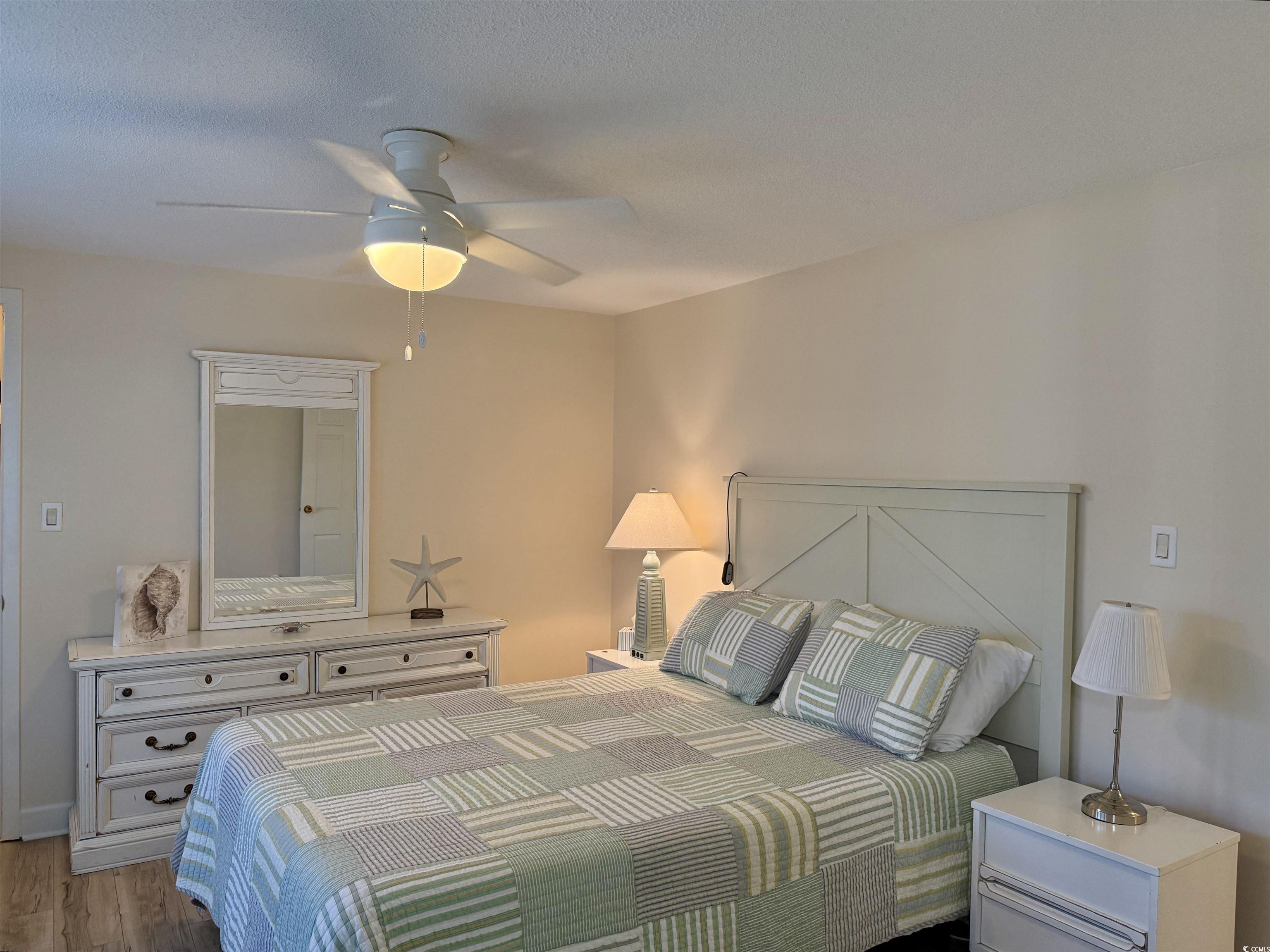 416 Oceanside Drive Surfside Beach, SC 29575 - Photo 18 of 37 Bedroom with wood finished floors and ceiling fan