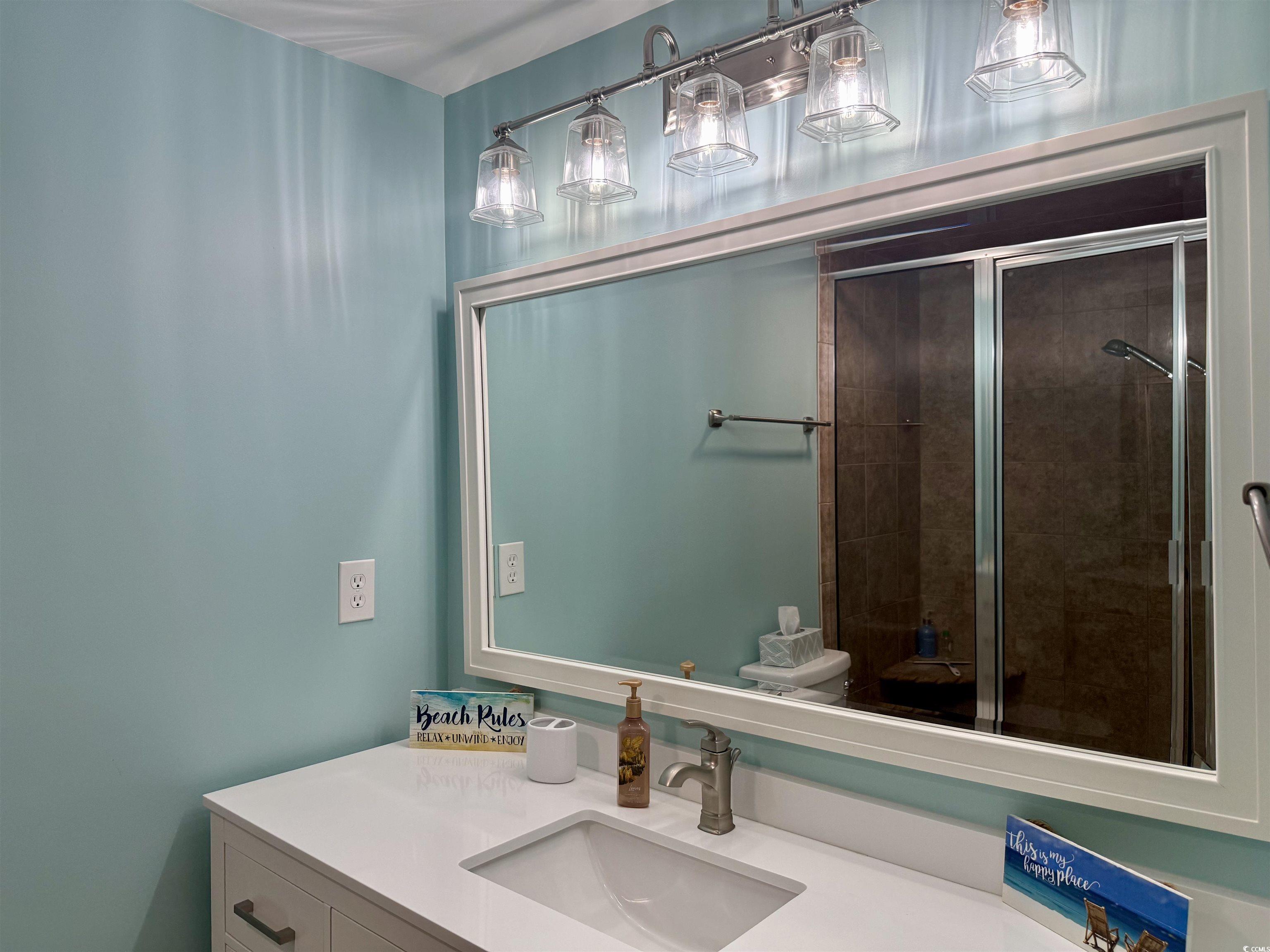 416 Oceanside Drive Surfside Beach, SC 29575 - Photo 19 of 37 Full bathroom featuring vanity and a stall shower