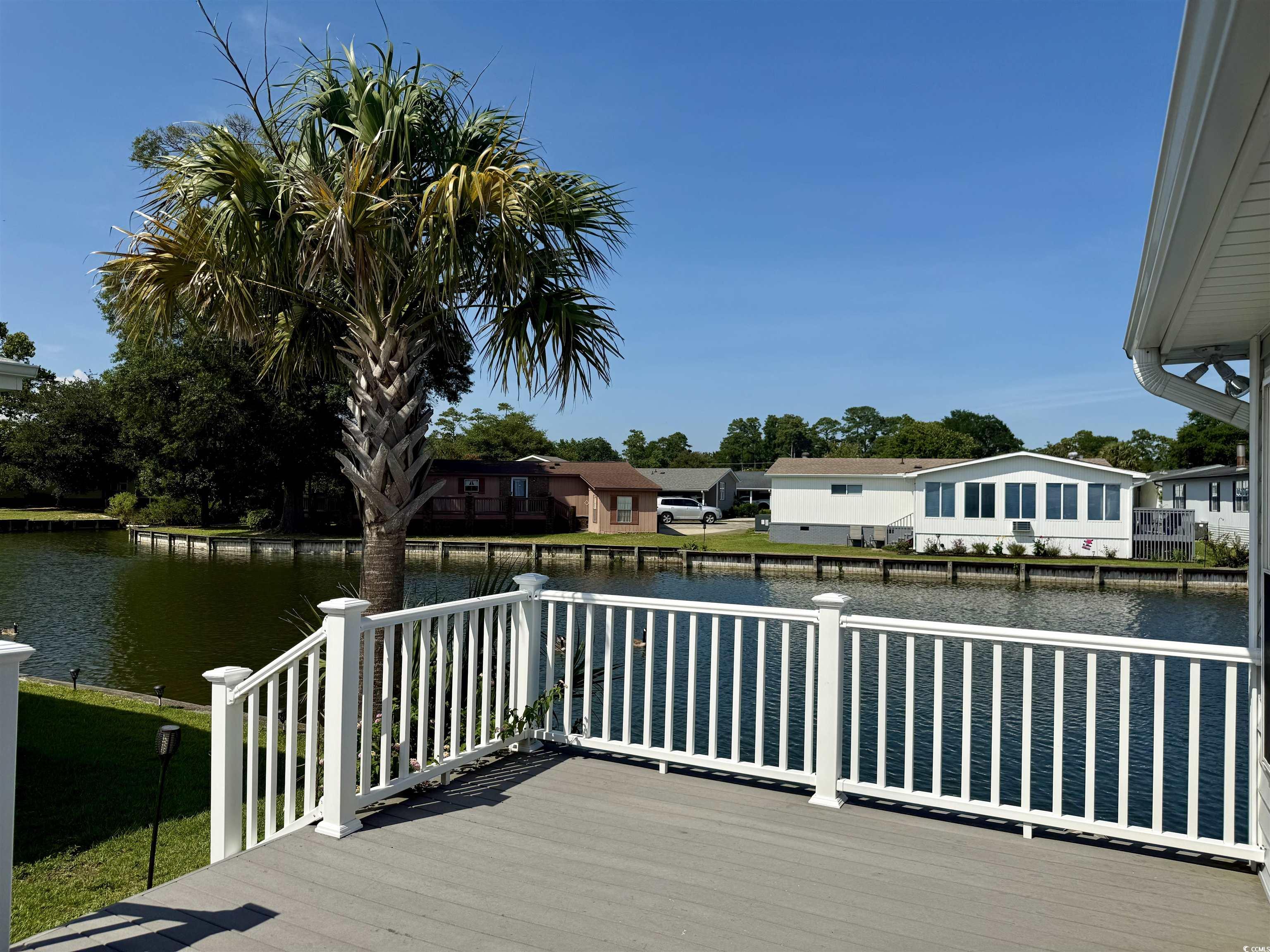 416 Oceanside Drive Surfside Beach, SC 29575 - Photo 26 of 37 Wooden terrace featuring a water view and a residential view