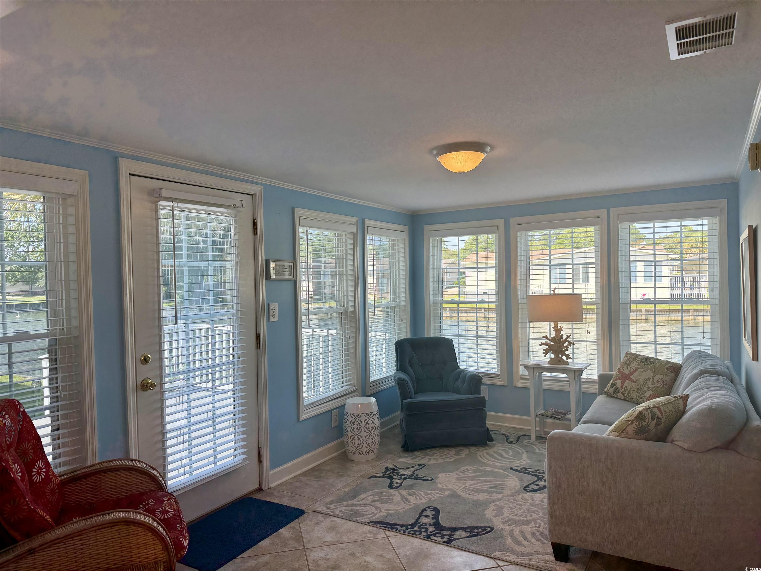 416 Oceanside Drive Surfside Beach, SC 29575 - Photo 8 of 37 Sunroom / solarium with ornamental molding and tile patterned floors