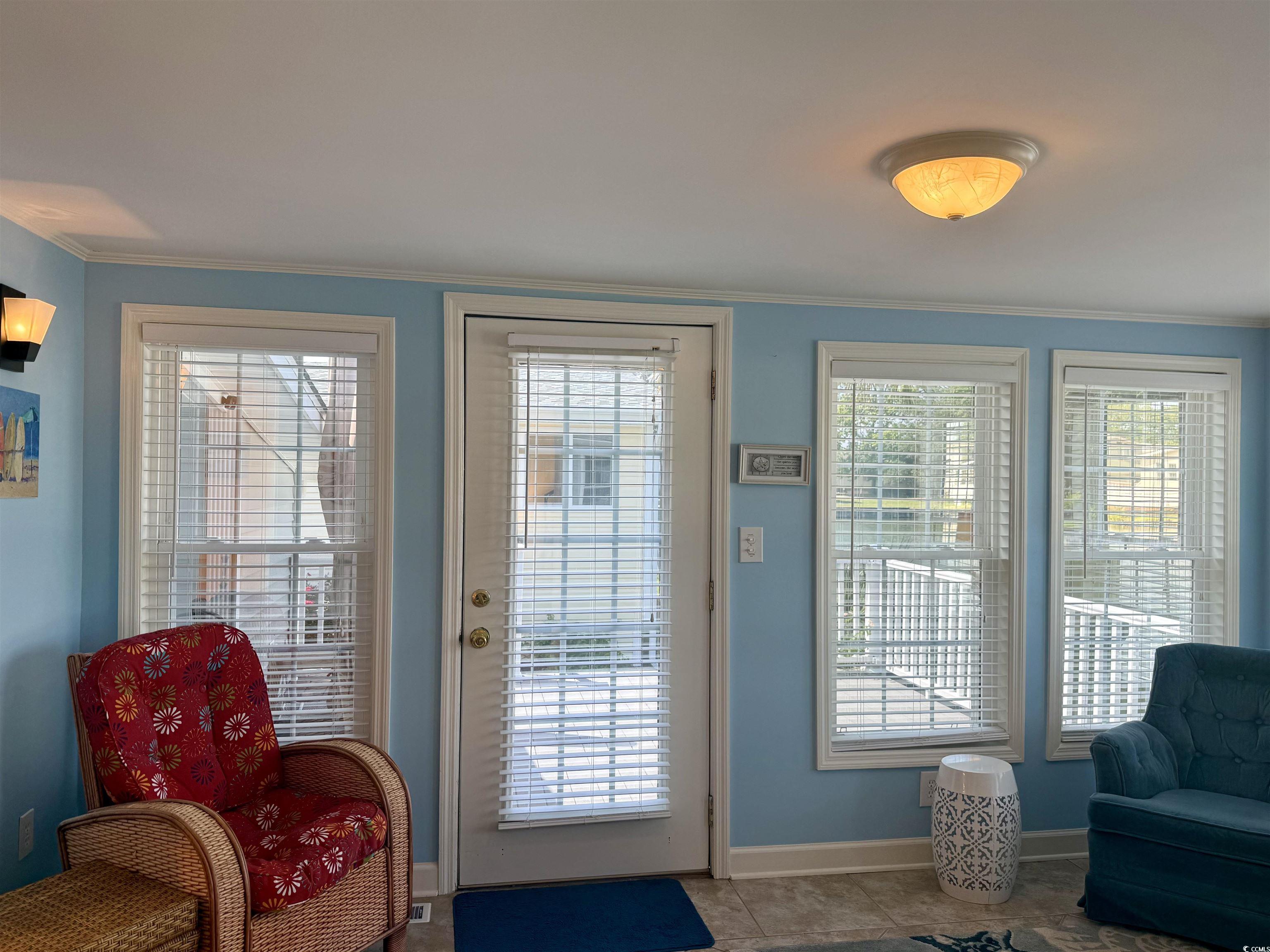416 Oceanside Drive Surfside Beach, SC 29575 - Photo 9 of 37 Entryway with baseboards and crown molding