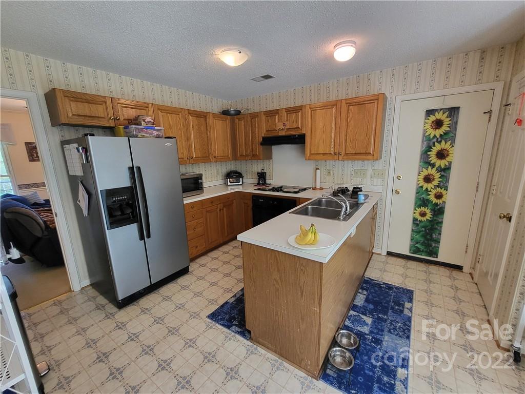 9216 Torrence Crossing Drive Huntersville, NC 28078 - Photo 18 of 34 a utility room with wooden floor washer and dryer