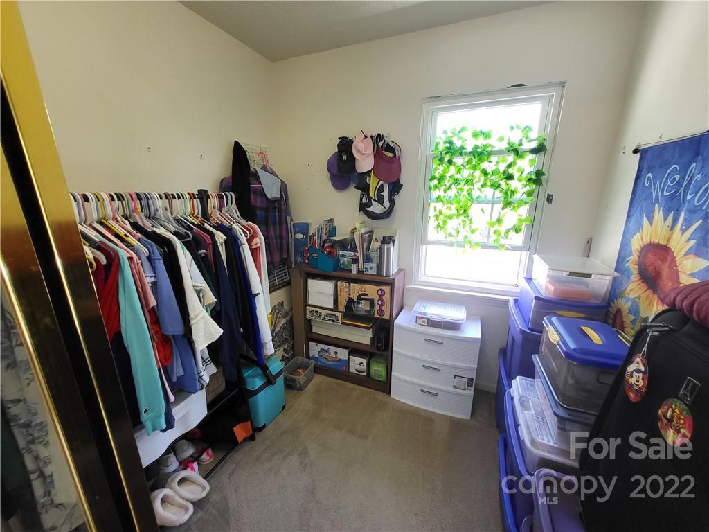 9216 Torrence Crossing Drive Huntersville, NC 28078 - Photo 28 of 34 a view of walk in closet with clothes