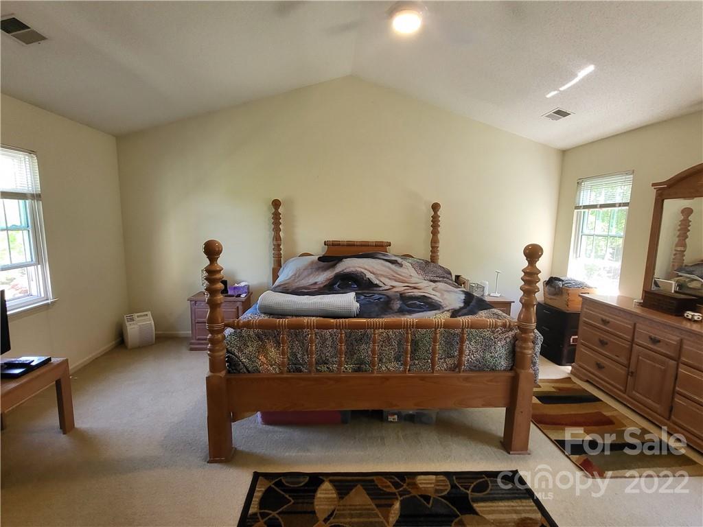 9216 Torrence Crossing Drive Huntersville, NC 28078 - Photo 32 of 34 a bed room with furniture and a window
