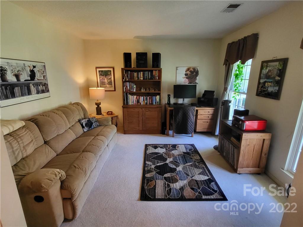 9216 Torrence Crossing Drive Huntersville, NC 28078 - Photo 7 of 34 a living room with furniture and a couch