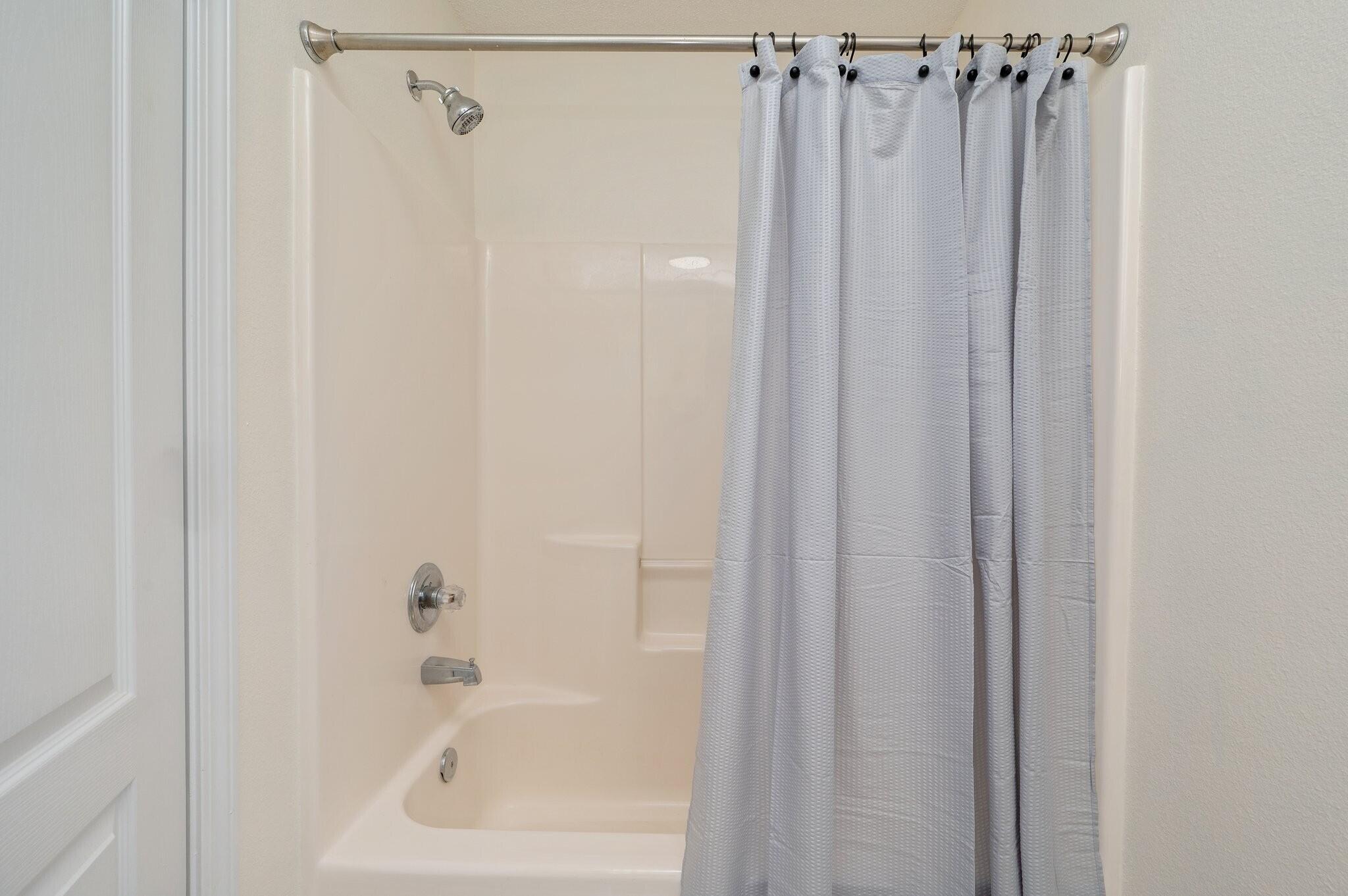 416 Swift Fox Run Crestview, FL 32536 - Photo 26 of 32 a bathroom with a shower and a tub