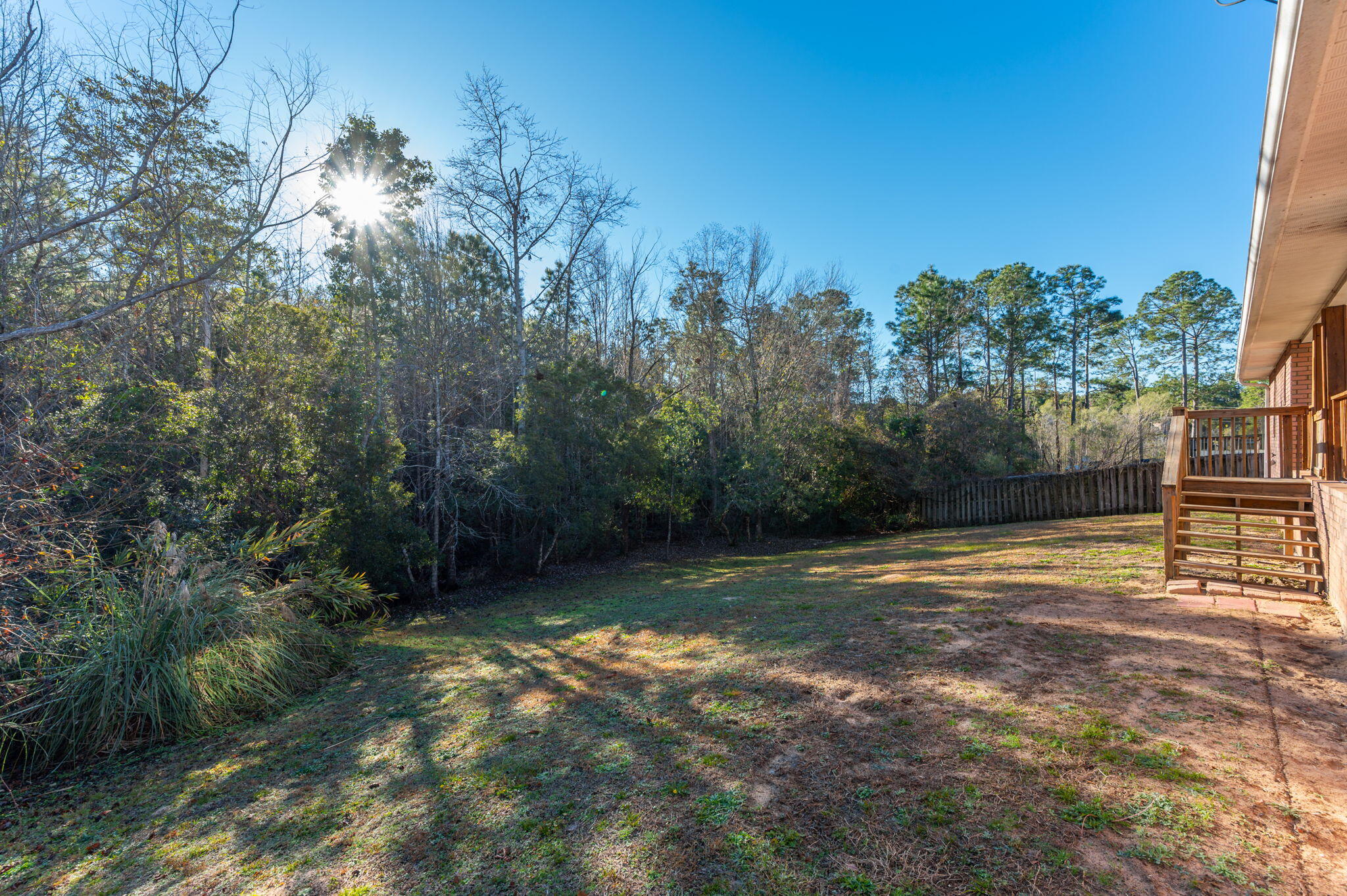 416 Swift Fox Run Crestview, FL 32536 - Photo 29 of 32 a backyard of a house with lots of green space