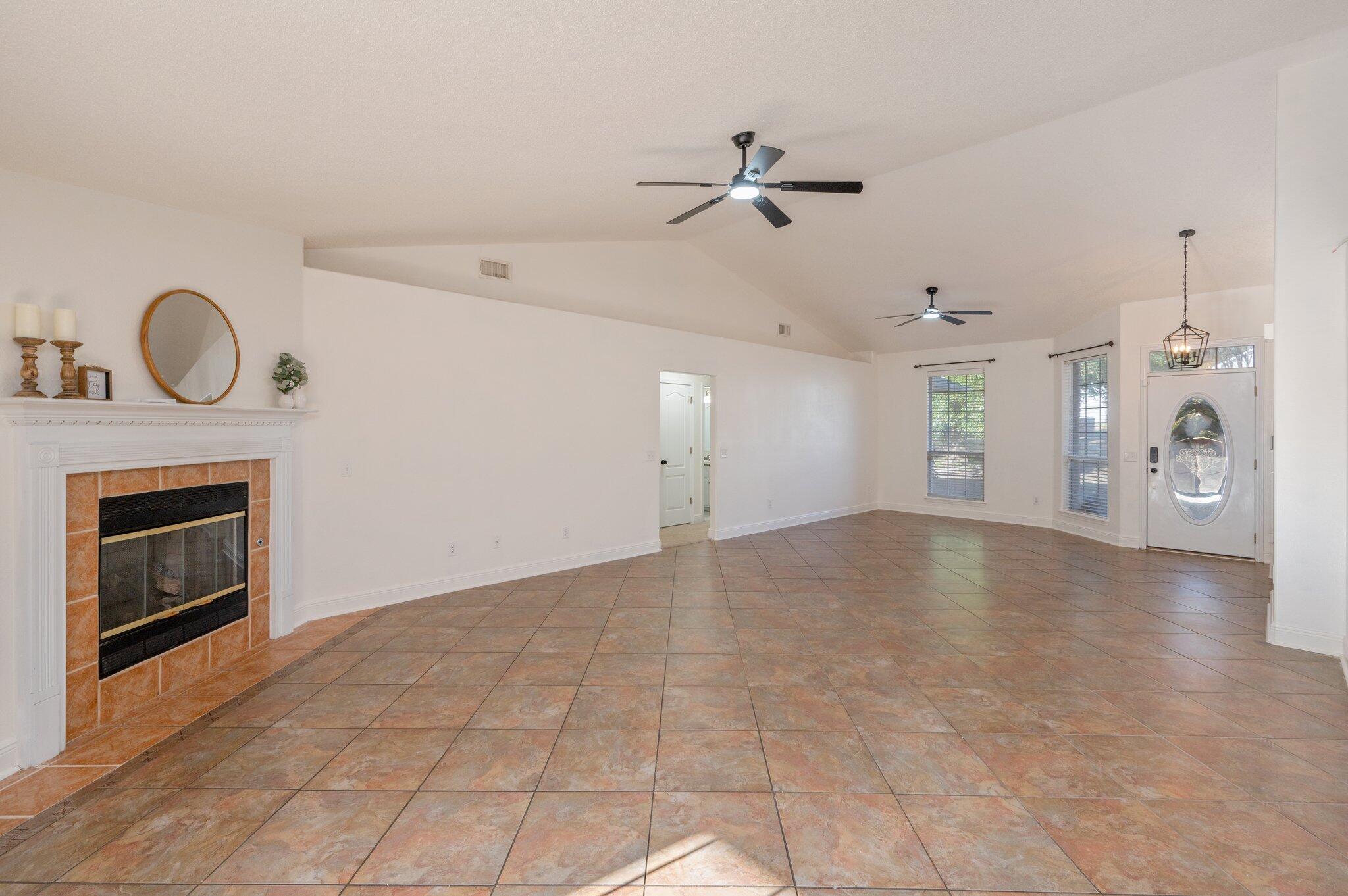 416 Swift Fox Run Crestview, FL 32536 - Photo 6 of 32 a view of a livingroom with a fireplace and window