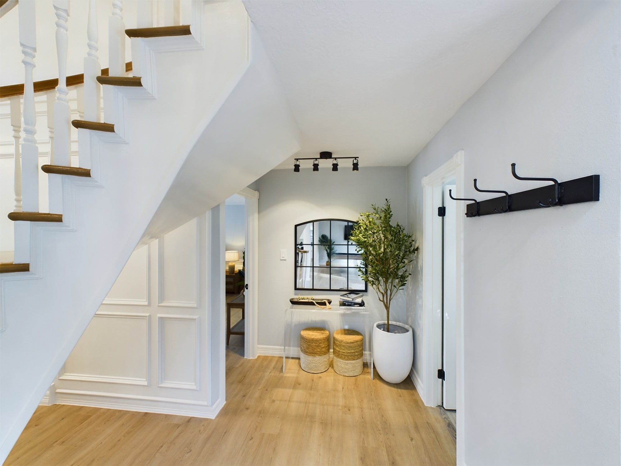 7702 Antoine Drive Houston, TX 77088 - Photo 18 of 50 Back Across the Foyer to the Powder Room & Primary Bedroom