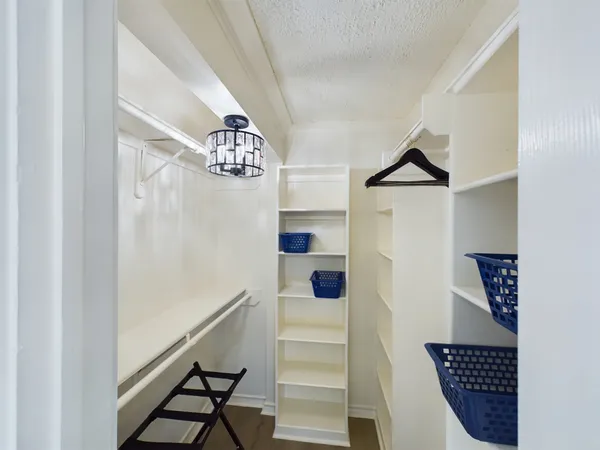 a bathroom with a glass shower door and a mirror