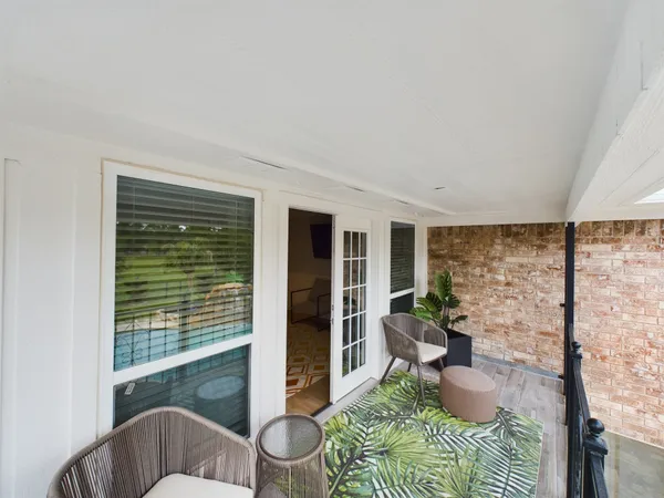a view of a two chair in the balcony