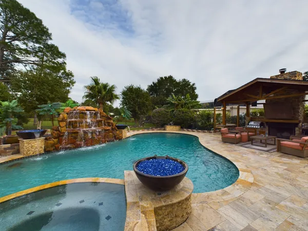 a view of yard with patio