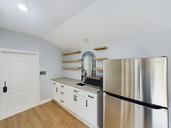 a bathroom with a shower and a sink