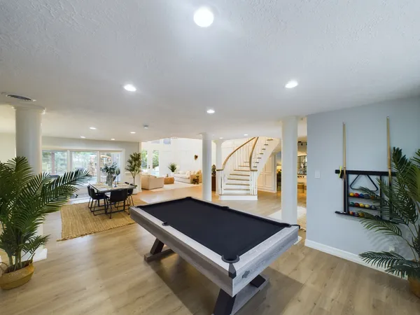 a living room with furniture chandelier and a chandelier