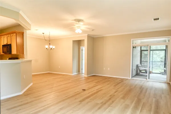 a view of a kitchen with a sink and a window