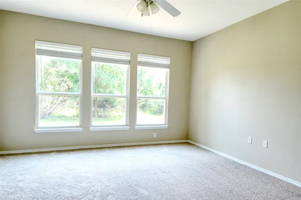 a kitchen with granite countertop a stove top oven microwave and cabinets