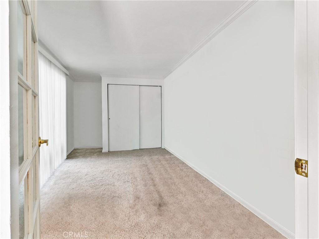 29501 Silverado Canyon Road Silverado, CA 92676 - Photo 17 of 44 Second bedroom. Spacious, open & bright. AI removed furnishings from room for pic. Sliding door on left leads to outside deck.