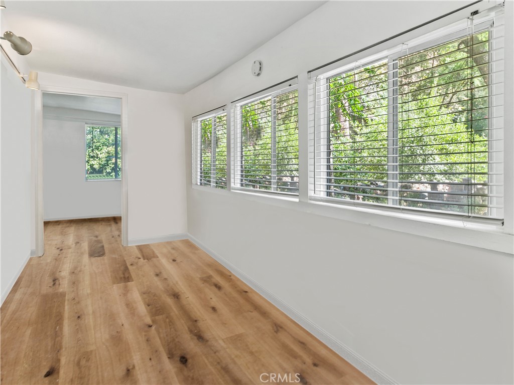 29501 Silverado Canyon Road Silverado, CA 92676 - Photo 19 of 44 3rd bedroom. Laundry room is off 3rd bedroom. Open feel with lots of light. This room has it's own private entrance & bathroom. Perfect for office? ADU? (AI removed furnishings in this pic).
