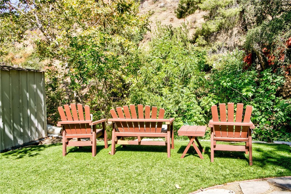 29501 Silverado Canyon Road Silverado, CA 92676 - Photo 31 of 49 Part of the back yard - chairs overlooking your private creek! Love the artificial grass for easy maintenance.