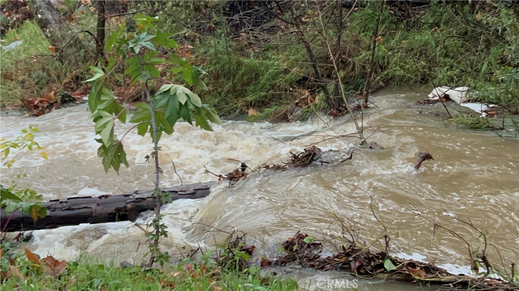 29501 Silverado Canyon Road Silverado, CA 92676 - Photo 37 of 49 Creek behind home during rain. Beautiful, yet, still enough space.