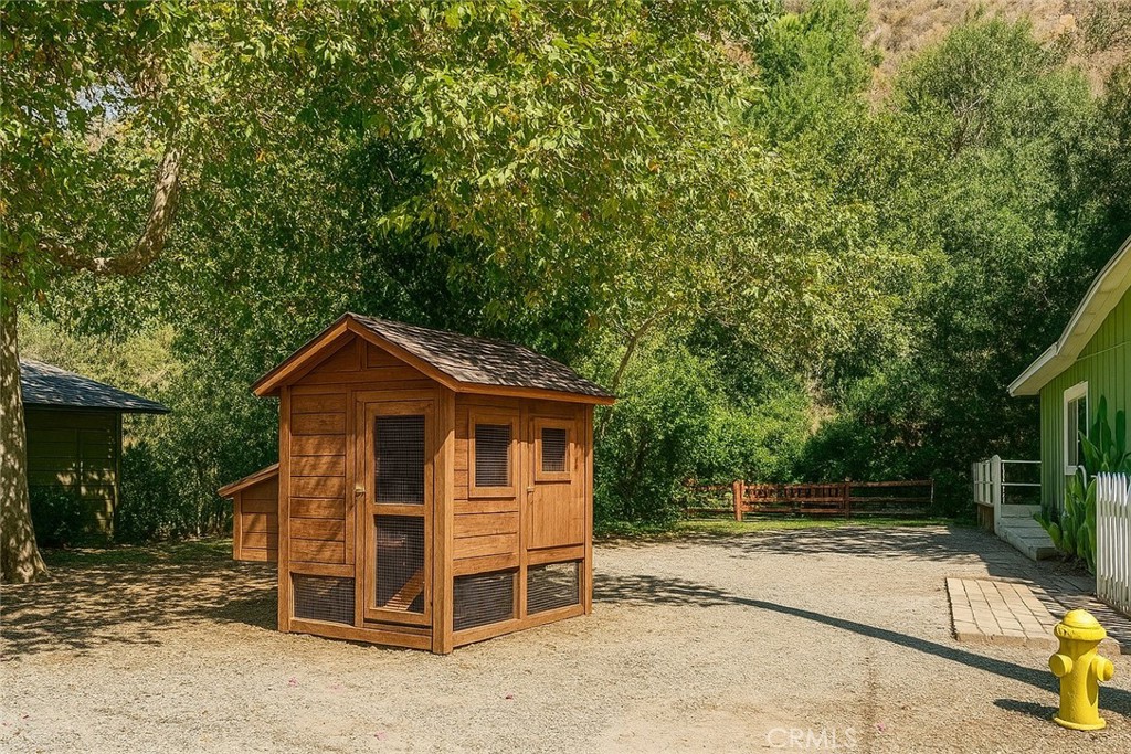 29501 Silverado Canyon Road Silverado, CA 92676 - Photo 41 of 49 Adjacent lot to home (AI enhanced photo with possibility of chicken coop)