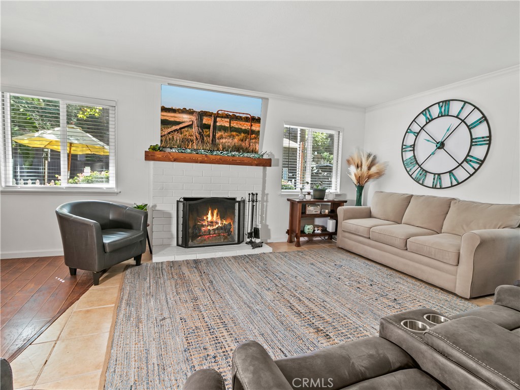 29501 Silverado Canyon Road Silverado, CA 92676 - Photo 7 of 49 Fireplace in living room is so cozy - overlooks private front courtyard with mountain view beyond that (AI added fire).