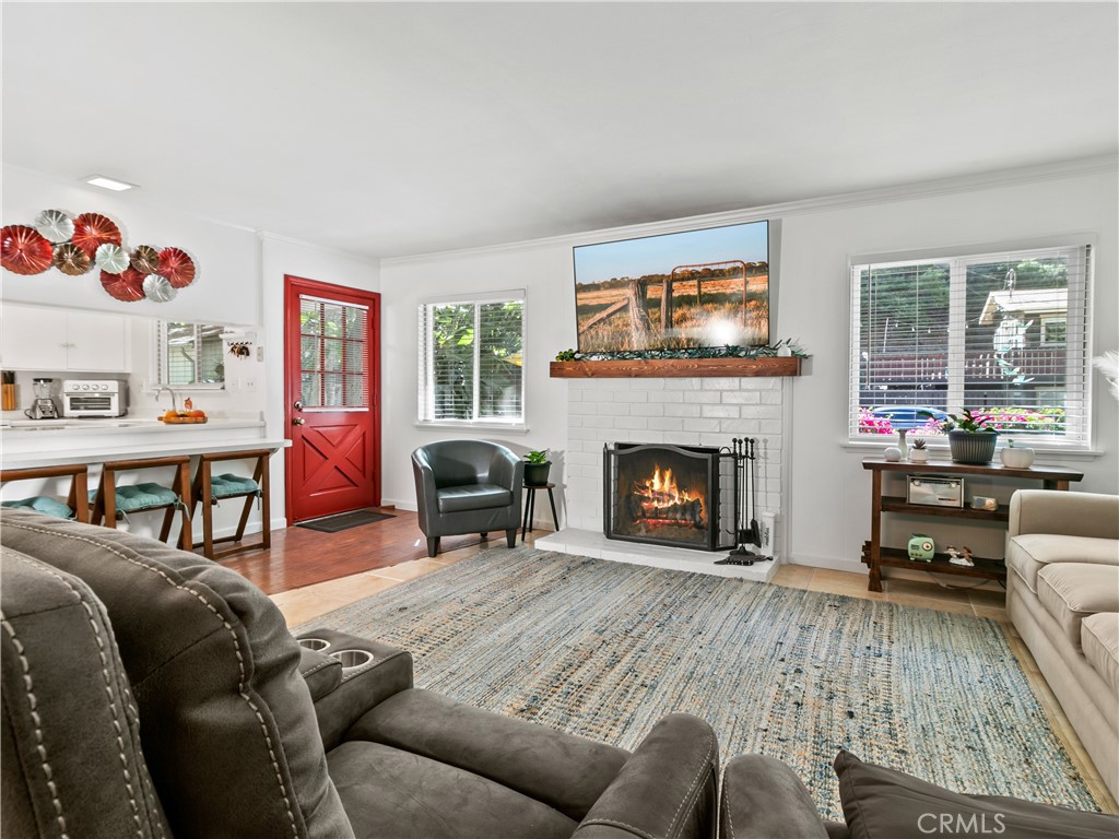 29501 Silverado Canyon Road Silverado, CA 92676 - Photo 8 of 49 Cozy fireplace & that stunning red door pops (AI added fire).