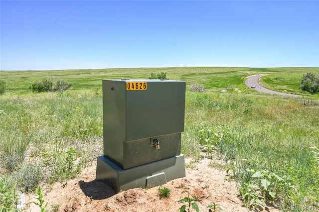 a view of a back yard from a balcony