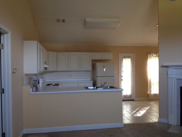 101 Ridgeview Drive Buckhead, GA 30625 - Photo 3 of 30 a room with kitchen island a sink a stove and white cabinets