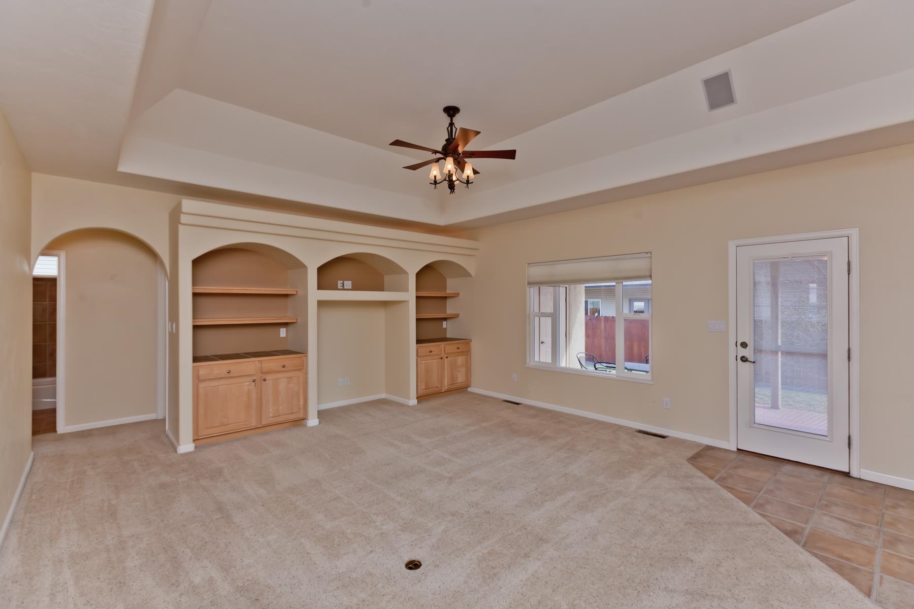 2433 Jack Creek Road Grand Junction, CO 81505 - Photo 11 of 41 an empty room with windows and ceiling fan