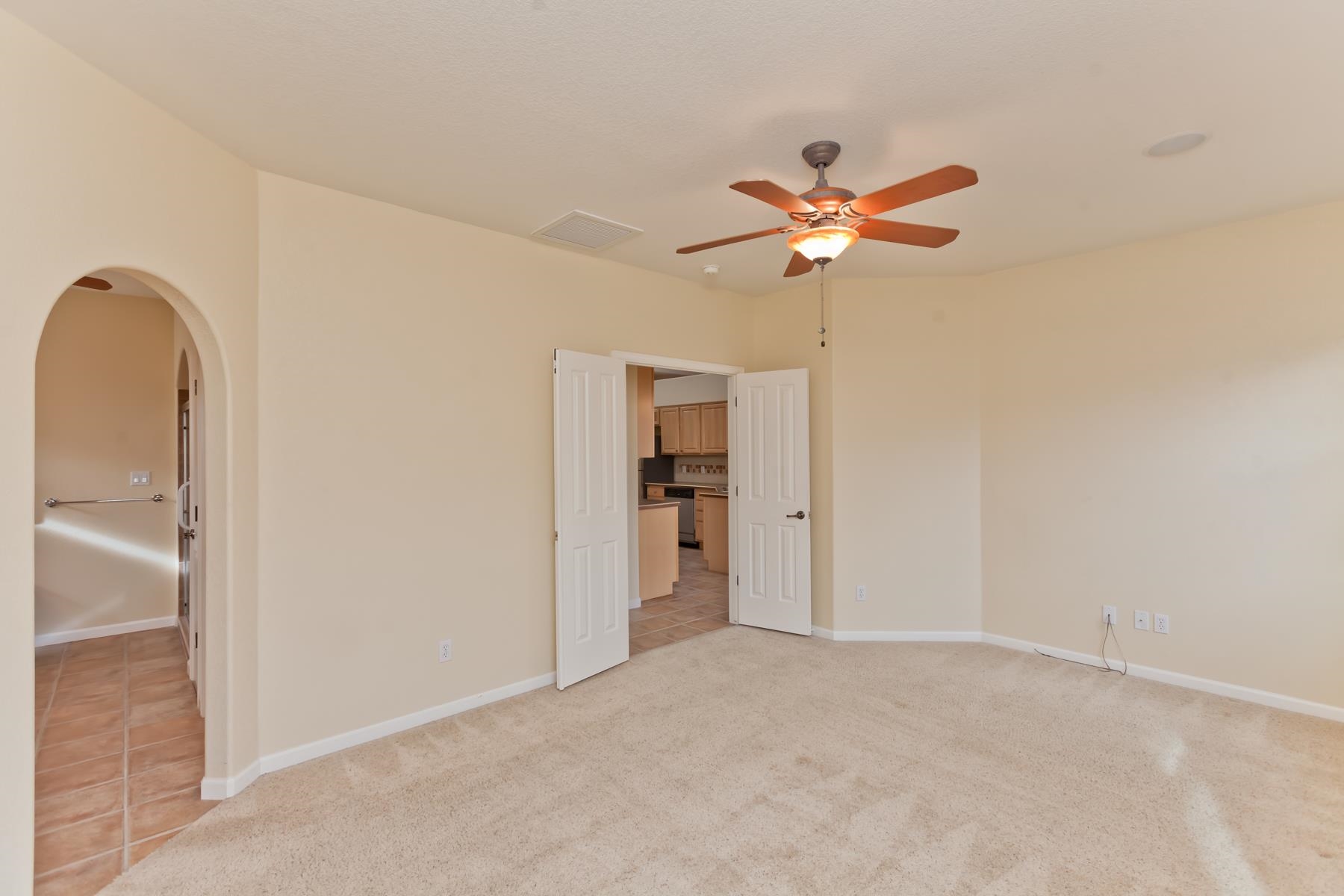 2433 Jack Creek Road Grand Junction, CO 81505 - Photo 14 of 41 a view of a room with a ceiling fan and a window