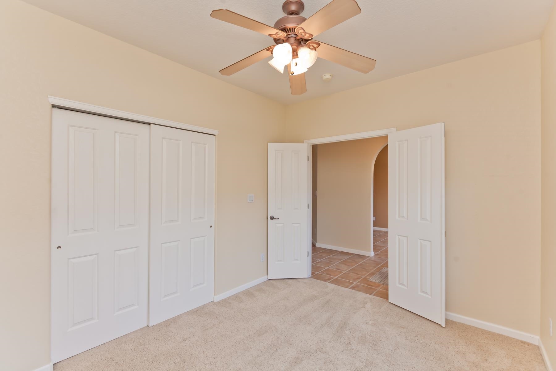 2433 Jack Creek Road Grand Junction, CO 81505 - Photo 23 of 41 an empty room with closet and a ceiling fan