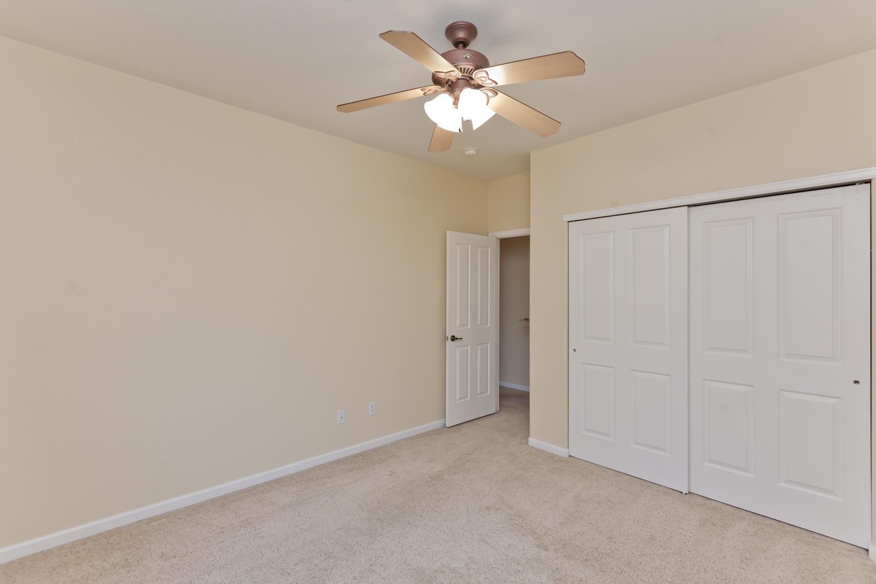 2433 Jack Creek Road Grand Junction, CO 81505 - Photo 26 of 41 a view of an empty room with a chandelier fan