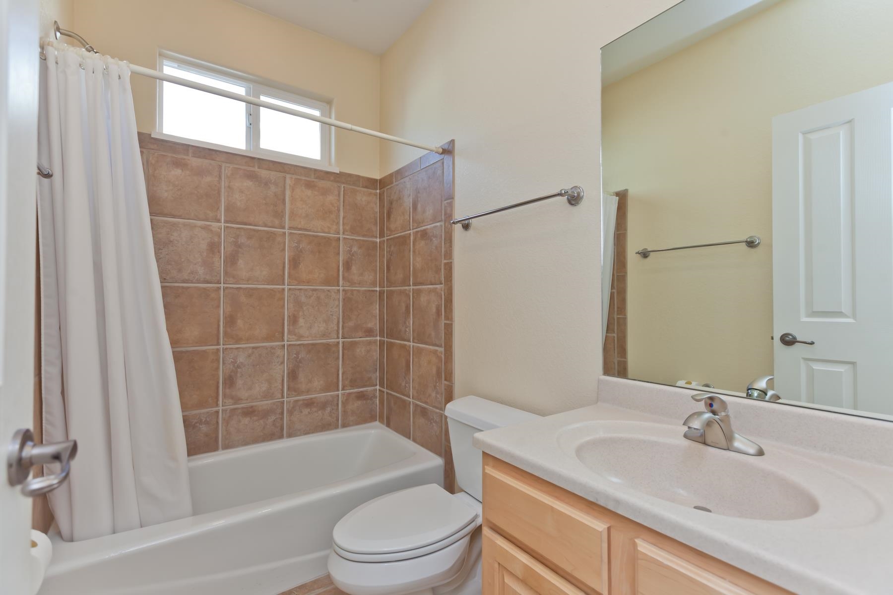 2433 Jack Creek Road Grand Junction, CO 81505 - Photo 28 of 41 a bathroom with a sink a toilet and shower