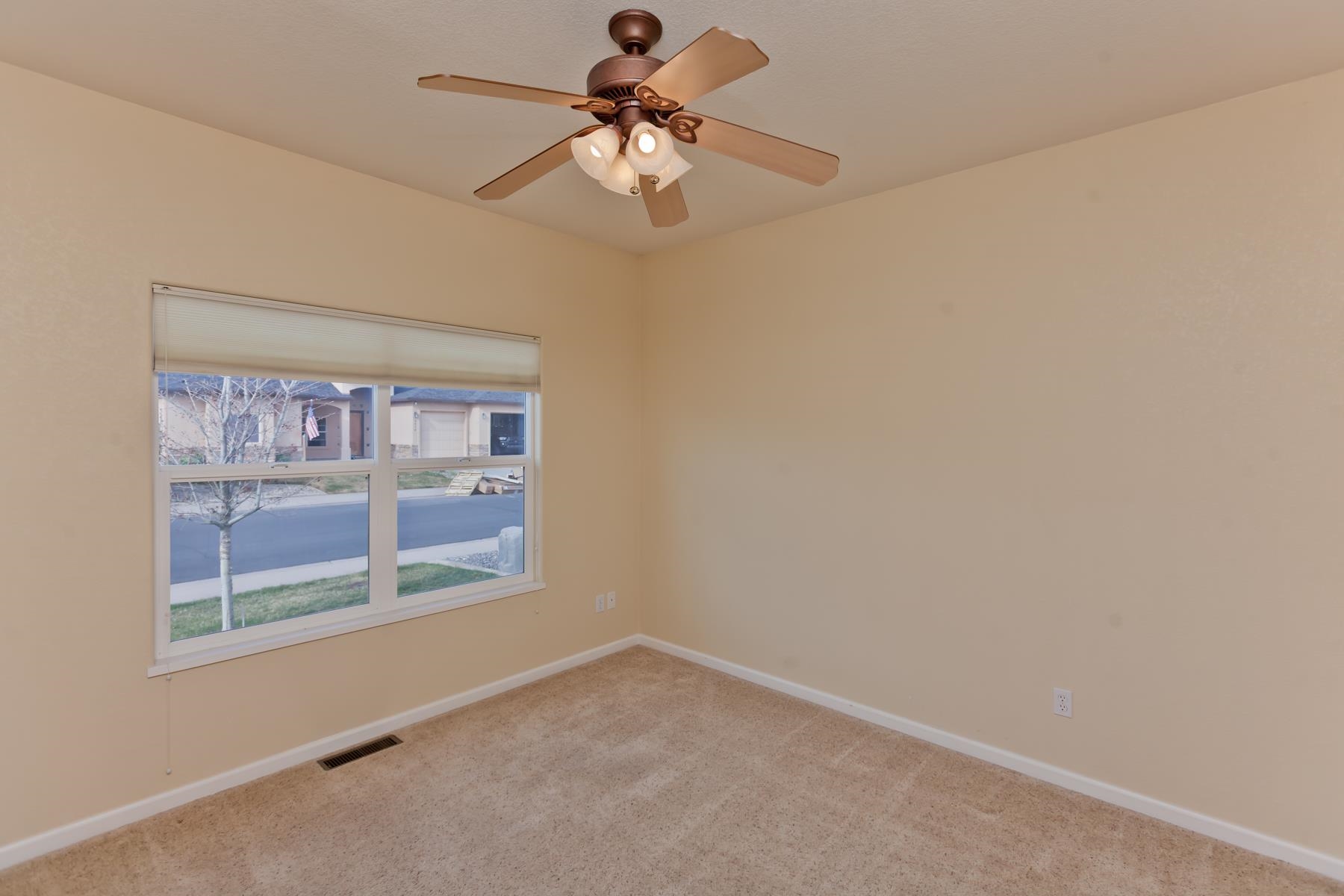 2433 Jack Creek Road Grand Junction, CO 81505 - Photo 29 of 41 a view of room with window and ceiling fan